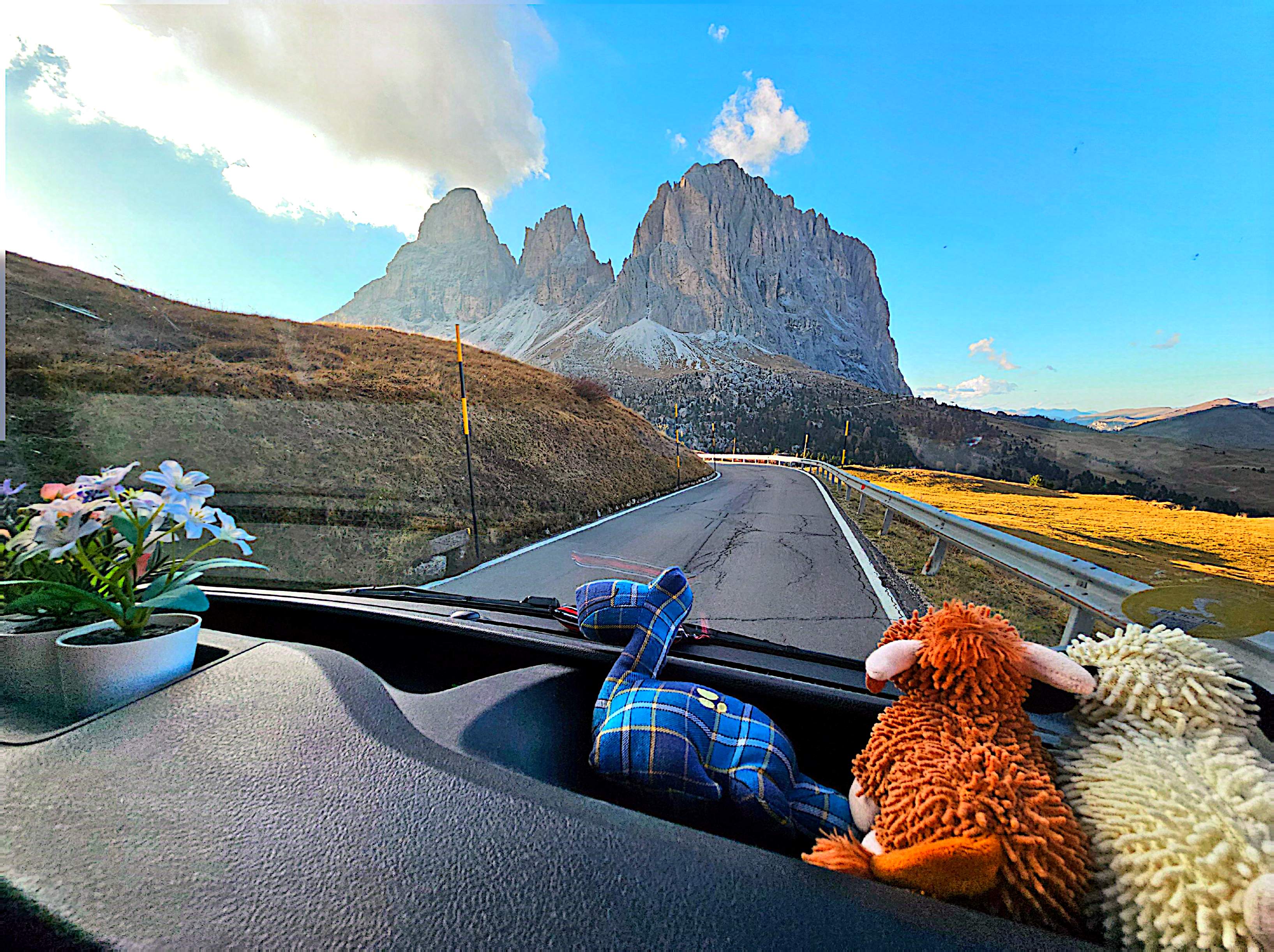 With their co-pilots on the dashboard—a nod to the Scottish Highlands trip that started it all—Christine and Rainer are always heading towards the next adventure, one breathtaking road at a time.